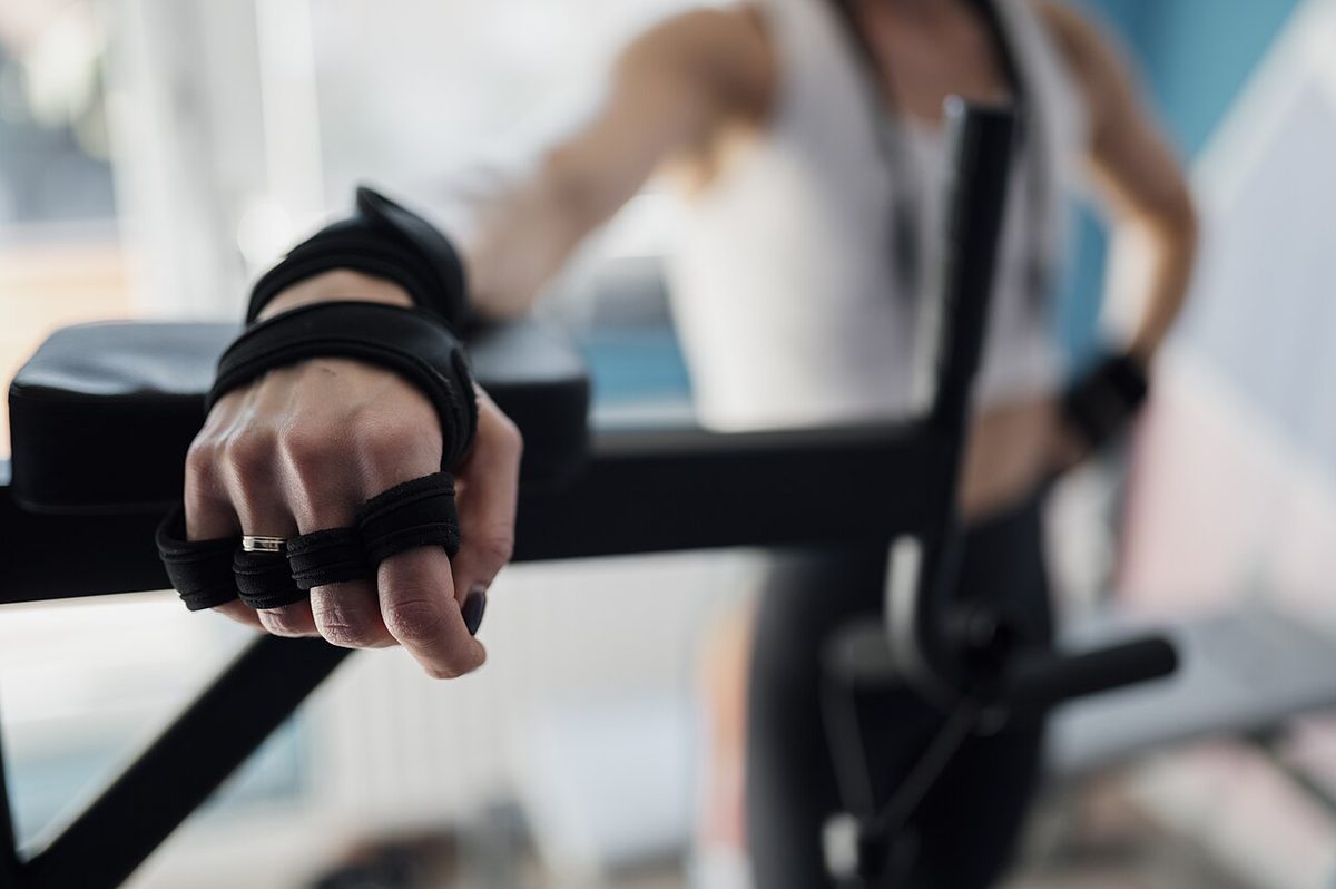 An athlete preparing for a strength-training session in a gym