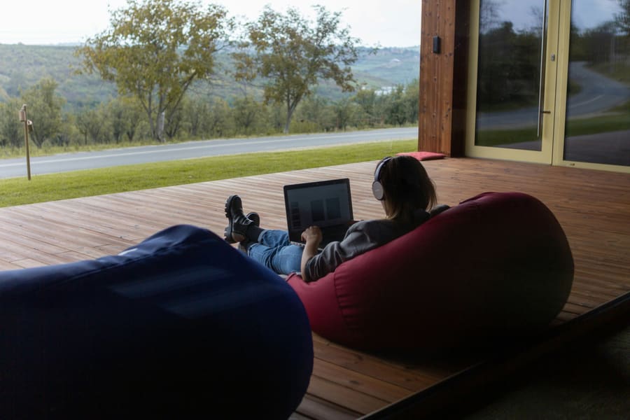 Publisher working outdoors on a deck