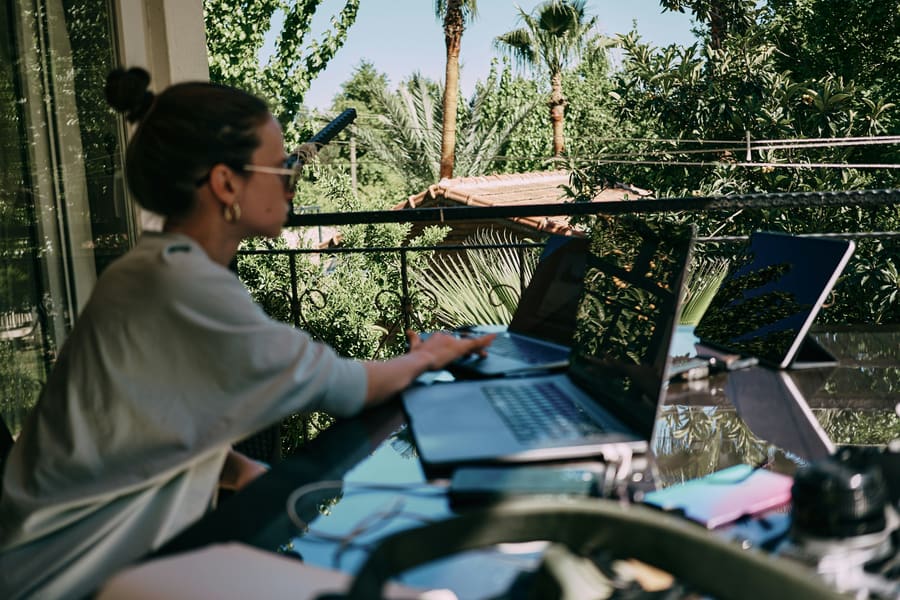 Publisher working outdoors on a terrace